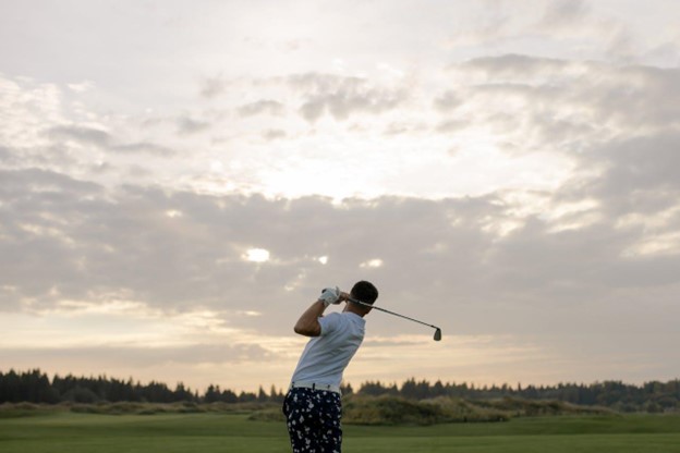 man looking at his own golf shot