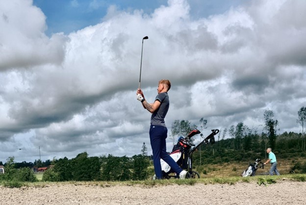 man holding finish after swinging golf club