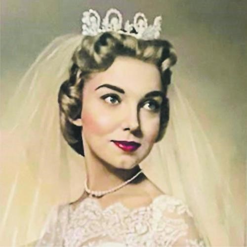 Young blind woman headshot in bridal gown.