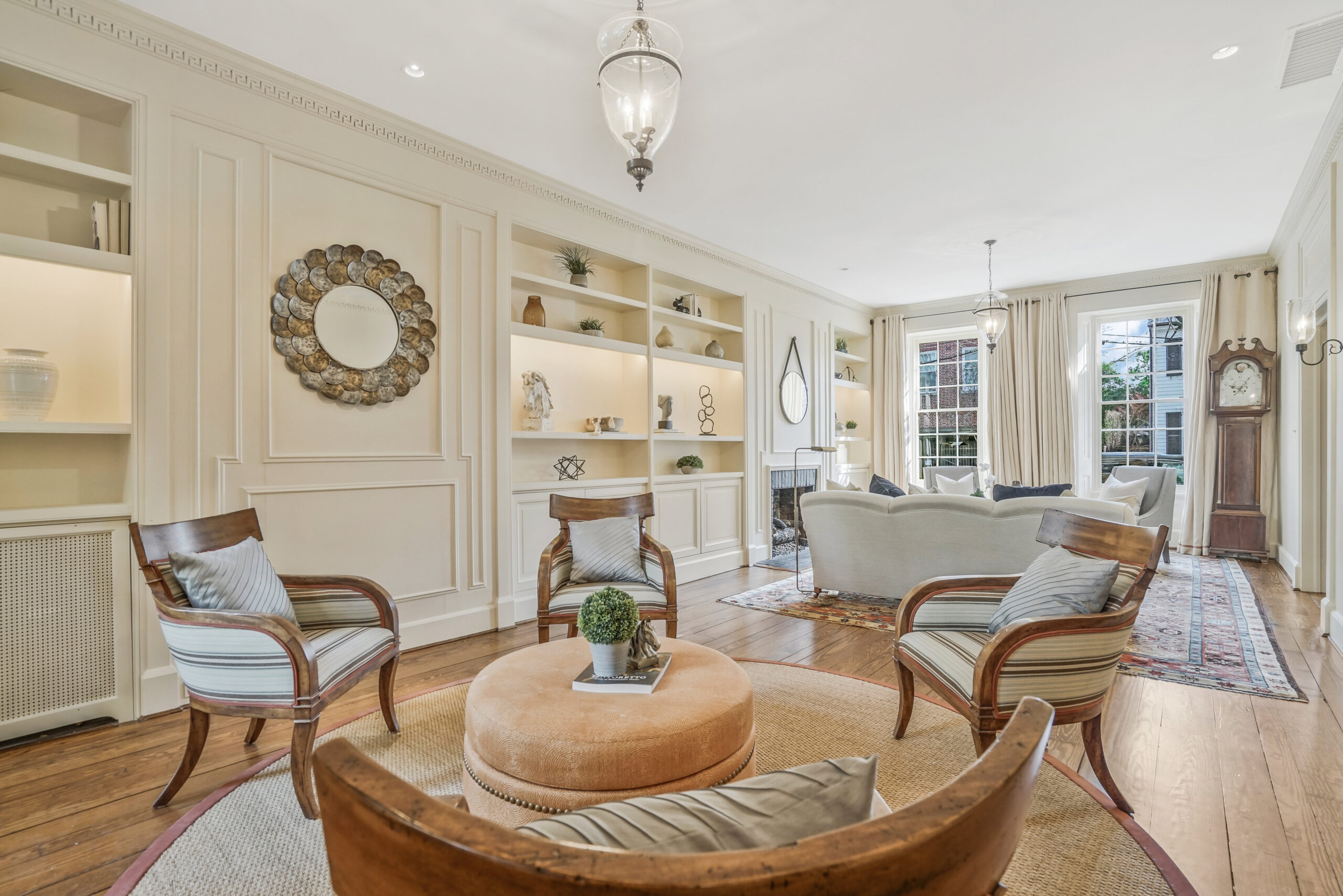 Bright room with three chairs and a sofa