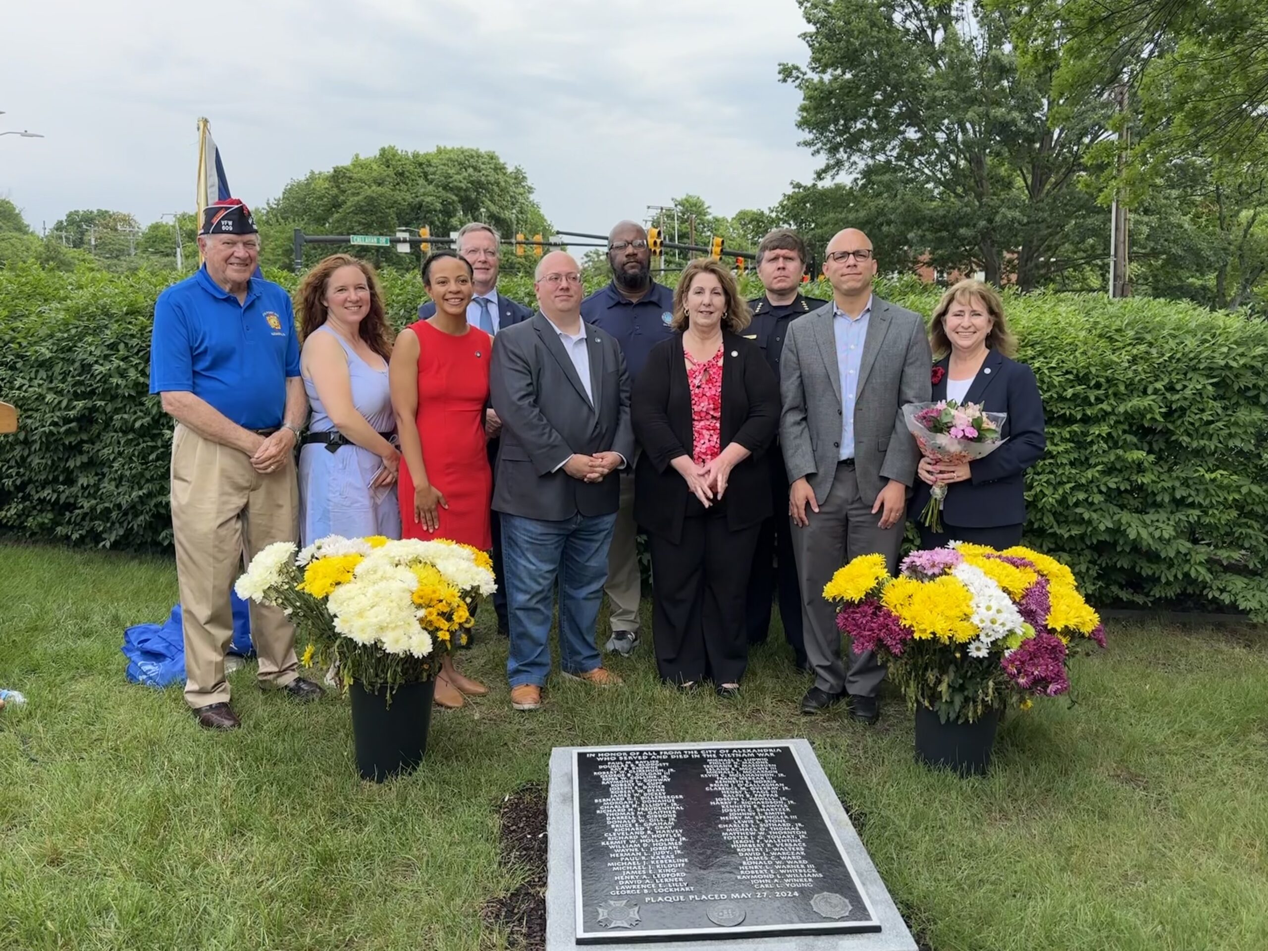 CIty officials gathered around he new Vietnam Way plaque