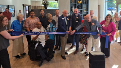 People cutting a ribbon