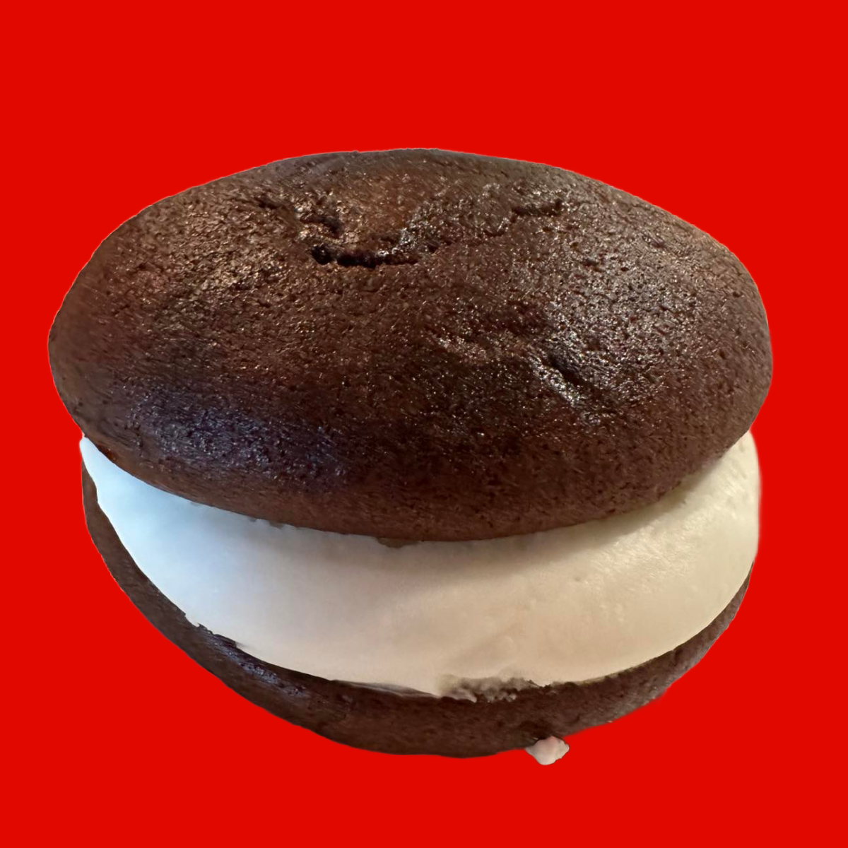Chocolate cake soft cookie with cream in middle.