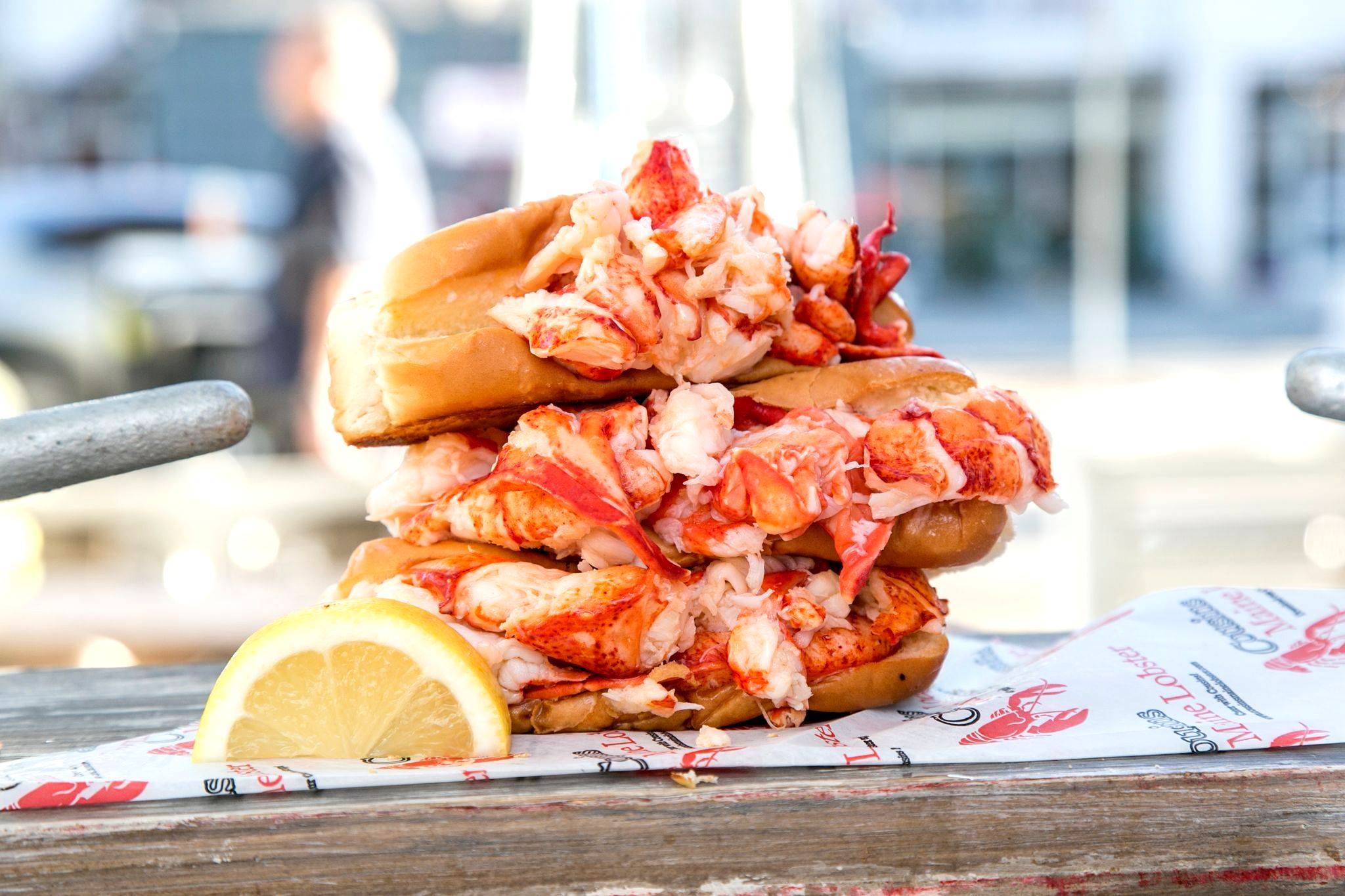 Three lobster rolls stacked.