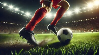 Soccer Player Dribbling Ball in Stadium Under Lights