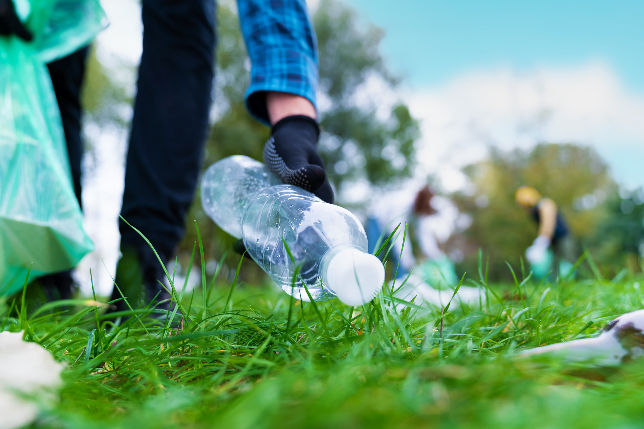 Volunteer cleaning area in park. Volunteer cleaning area in park.