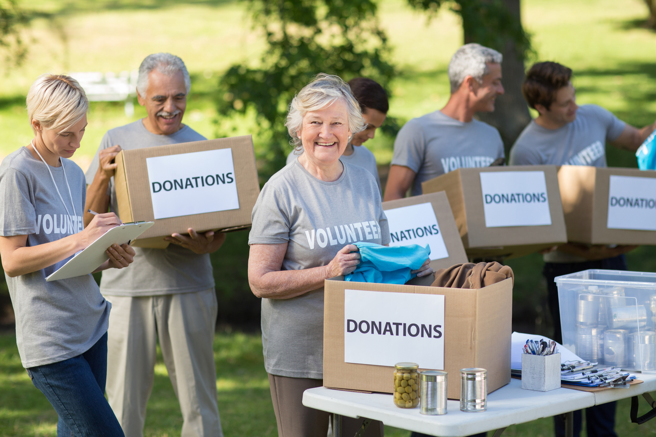 Happy family holding donations boxes Happy family holding donations boxes