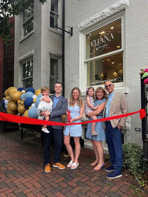 image0 ribbon cutting ceremont with people smiling
