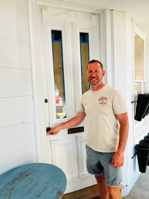 man opening door