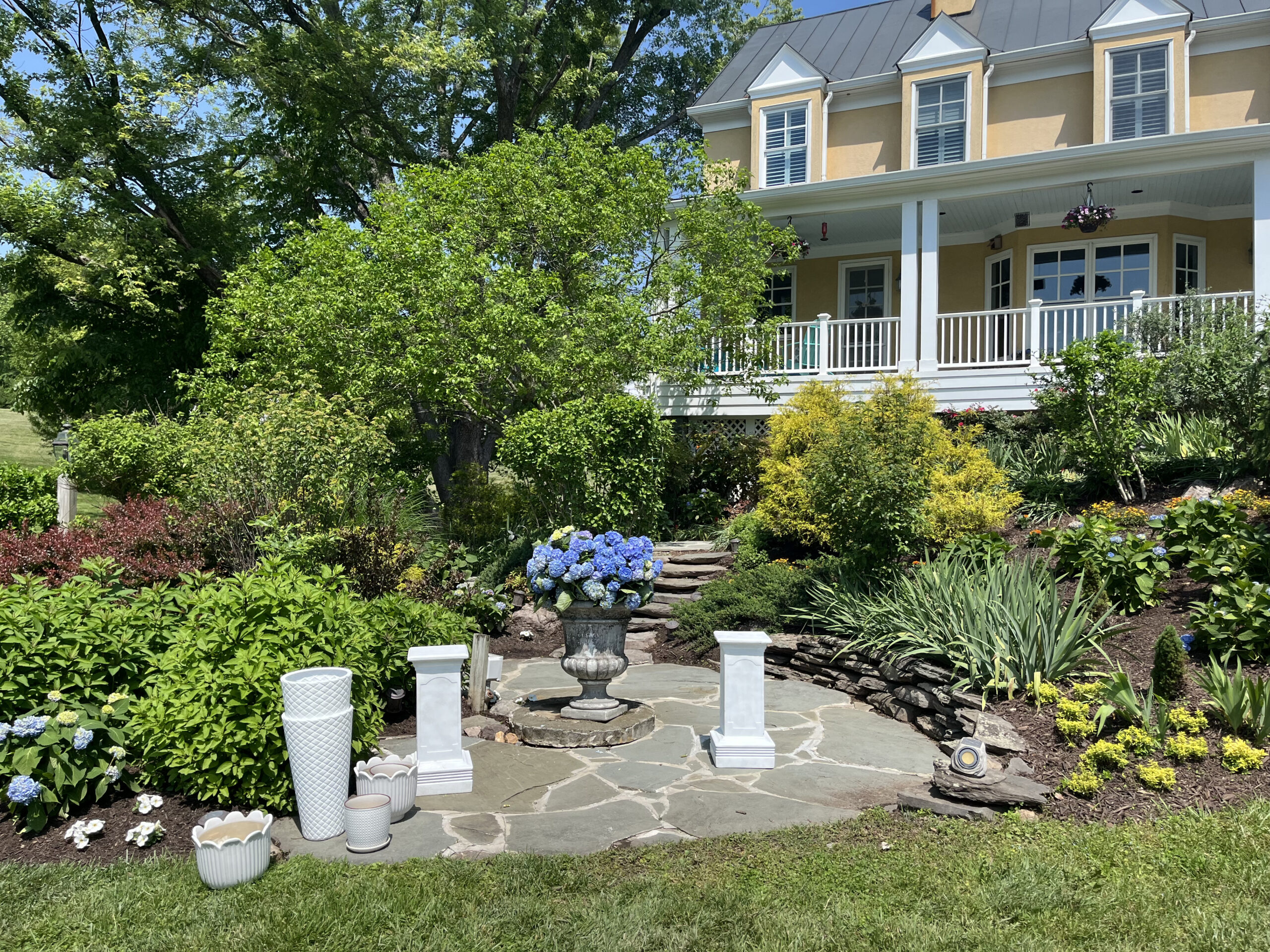 Jim Moran Wedding Circle Circle in front of yellow home