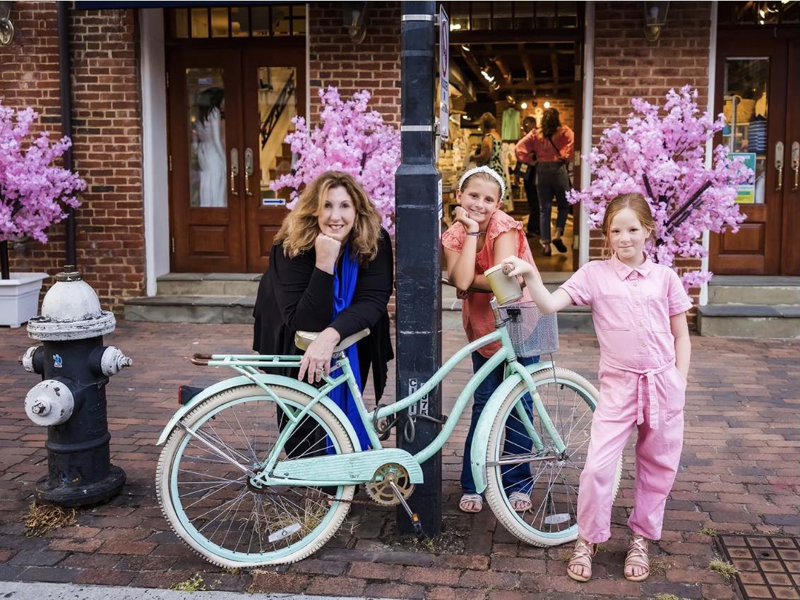 Amy Jackson photo posing with bike and two young girls Amy Jackson photo