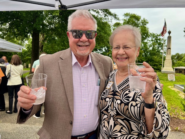 people smiling with drinks