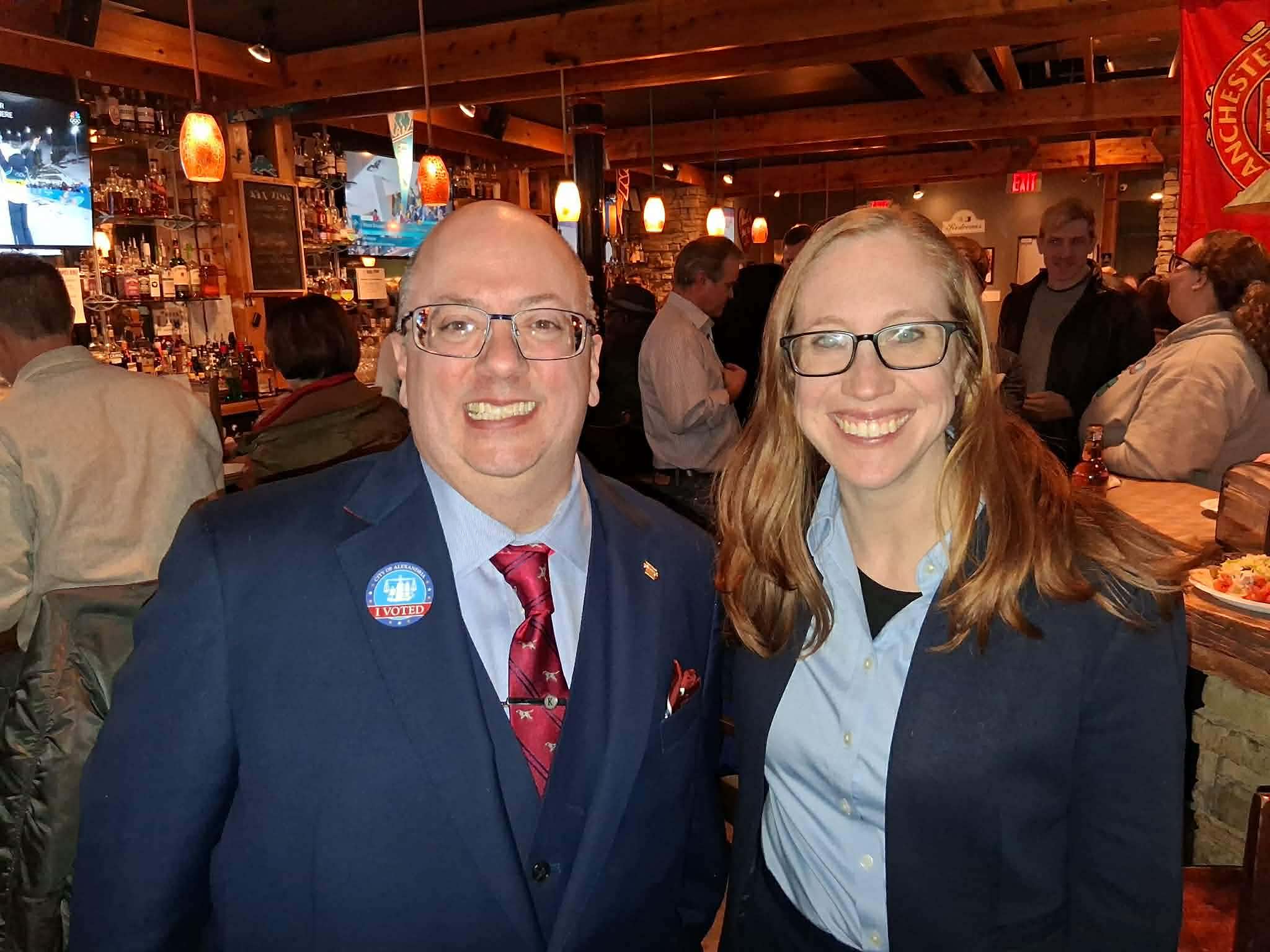 Elizabeth Bennett-Parker and R. Kirk McPike smile at a celebration party at Pork Barrel BBQ following their victories in Alexandria’s special elections.