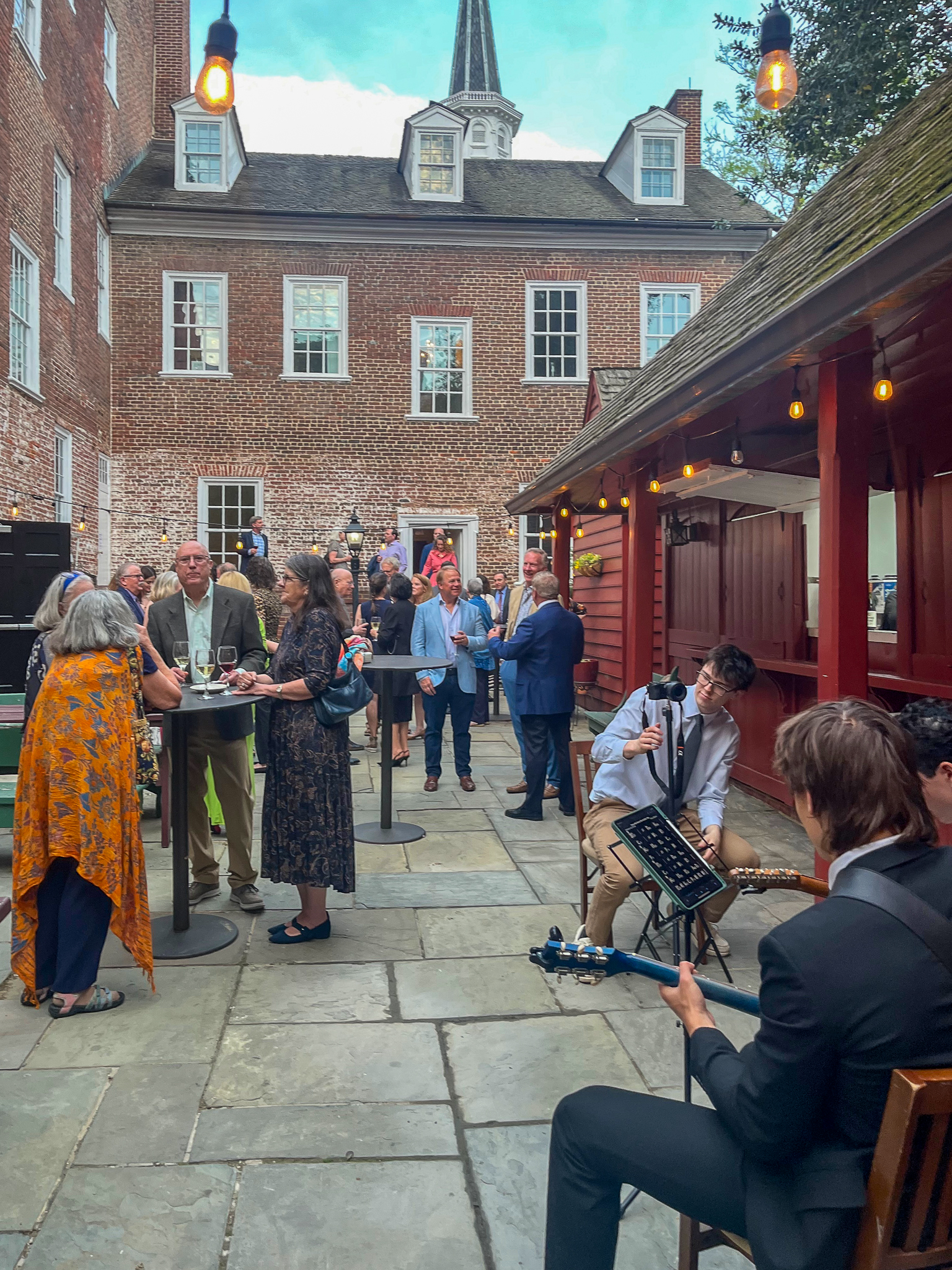 Enjoying the warm spring weather, the 2026 Spring Fling gathering started with food and beverages on the extensive back patio.