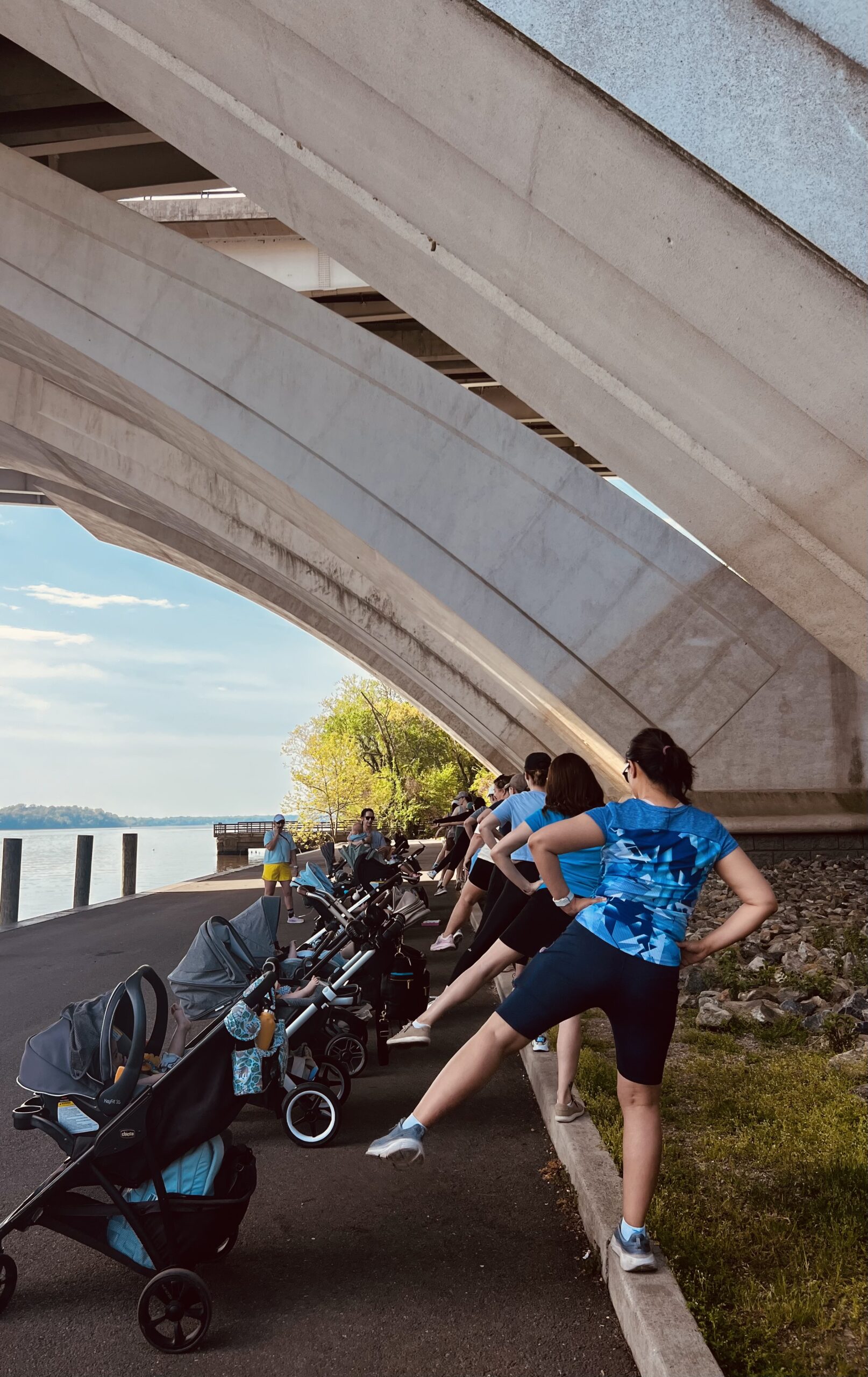 In the peaceful surroundings of Jones Point, mothers take part in fitness activities with their babies and young children.