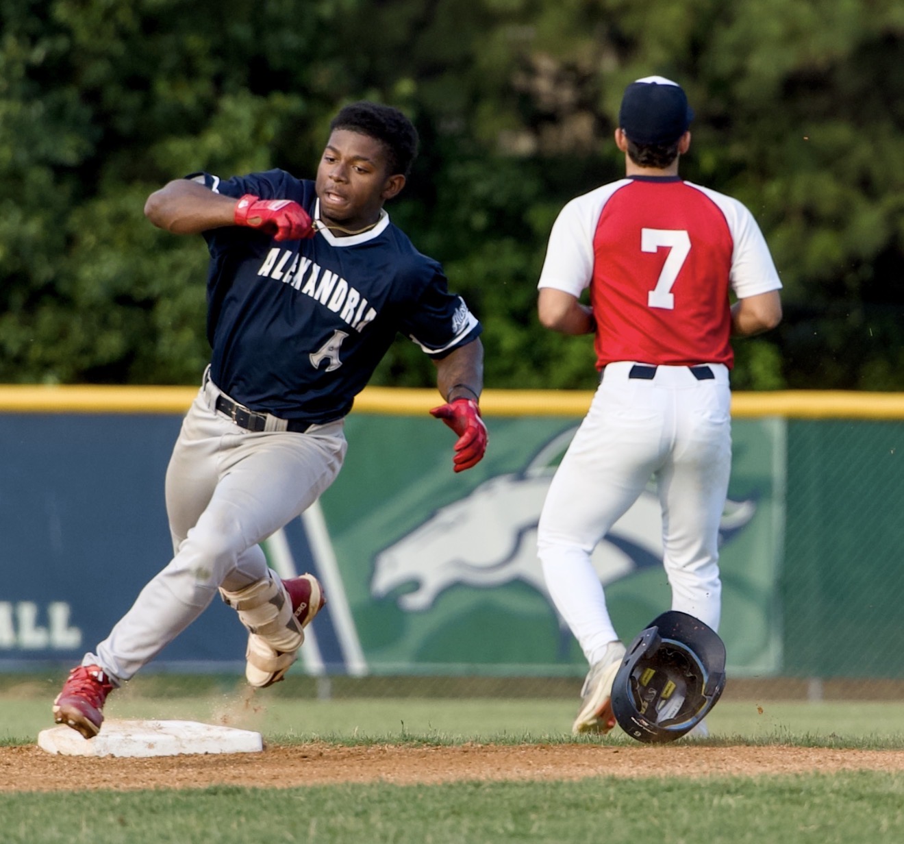 Elijah Grant Turns on the Speed Alexandria Aces runner Elijah rounds third base during a Cal Ripken League game against the South County Braves at Frank Mann Field.