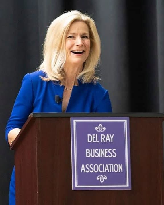 Julie Carey emceeing a Del Ray event. Photo: Visit Del Ray