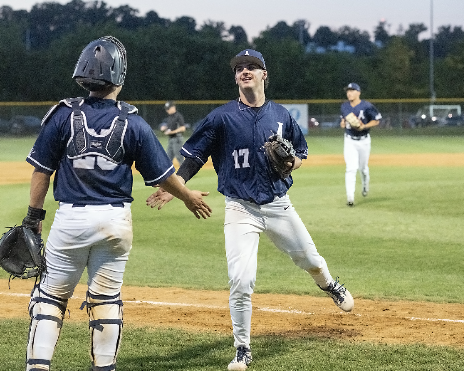 Pazak and Borger Celebrate Aces Victory Alexandria Aces players Matthew Pazak and Justin Borger celebrate on the field after the final out of an Aces victory at Frank Mann Field.