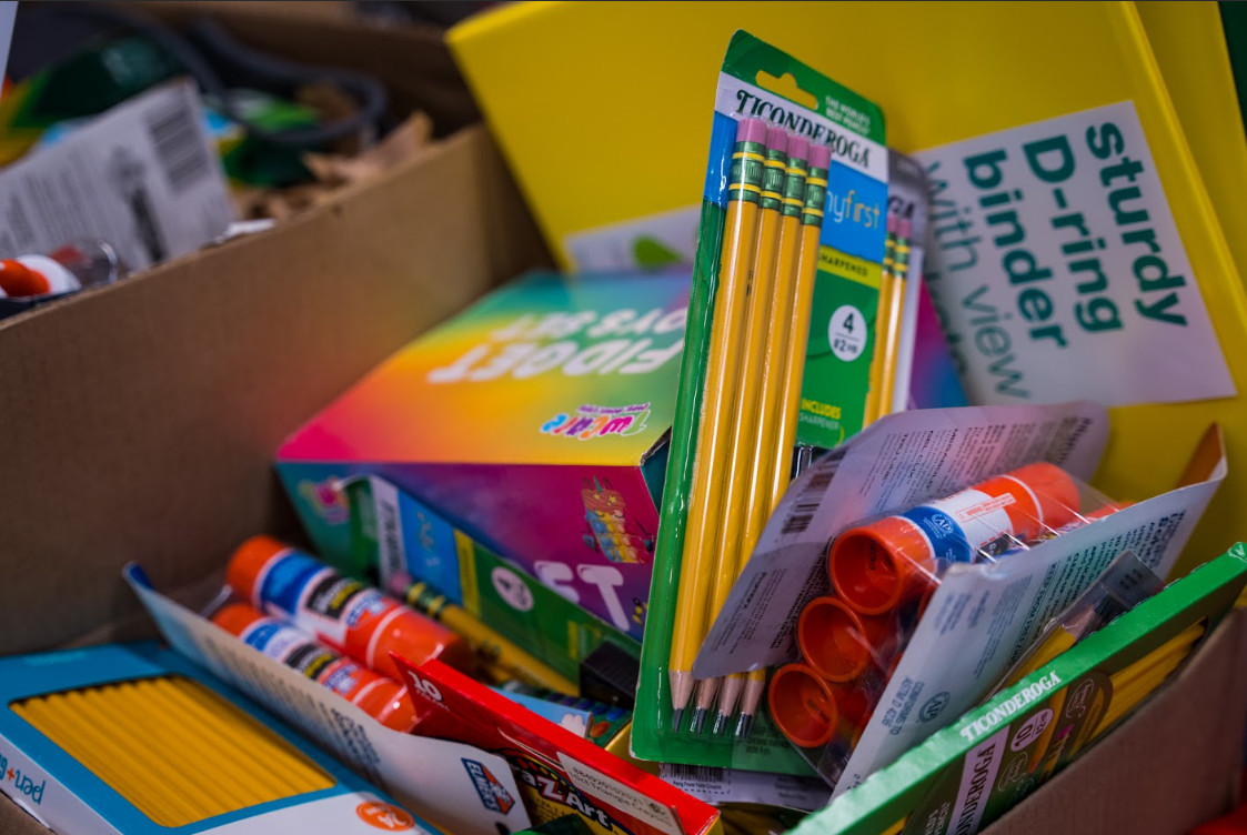 School Supplies Await Distribution to ACPS Students Boxes of donated school supplies, including pencils, glue sticks, folders, binders and classroom essentials, are prepared for distribution during the Alexandria City Public Schools Backpack & School Supply Drive.