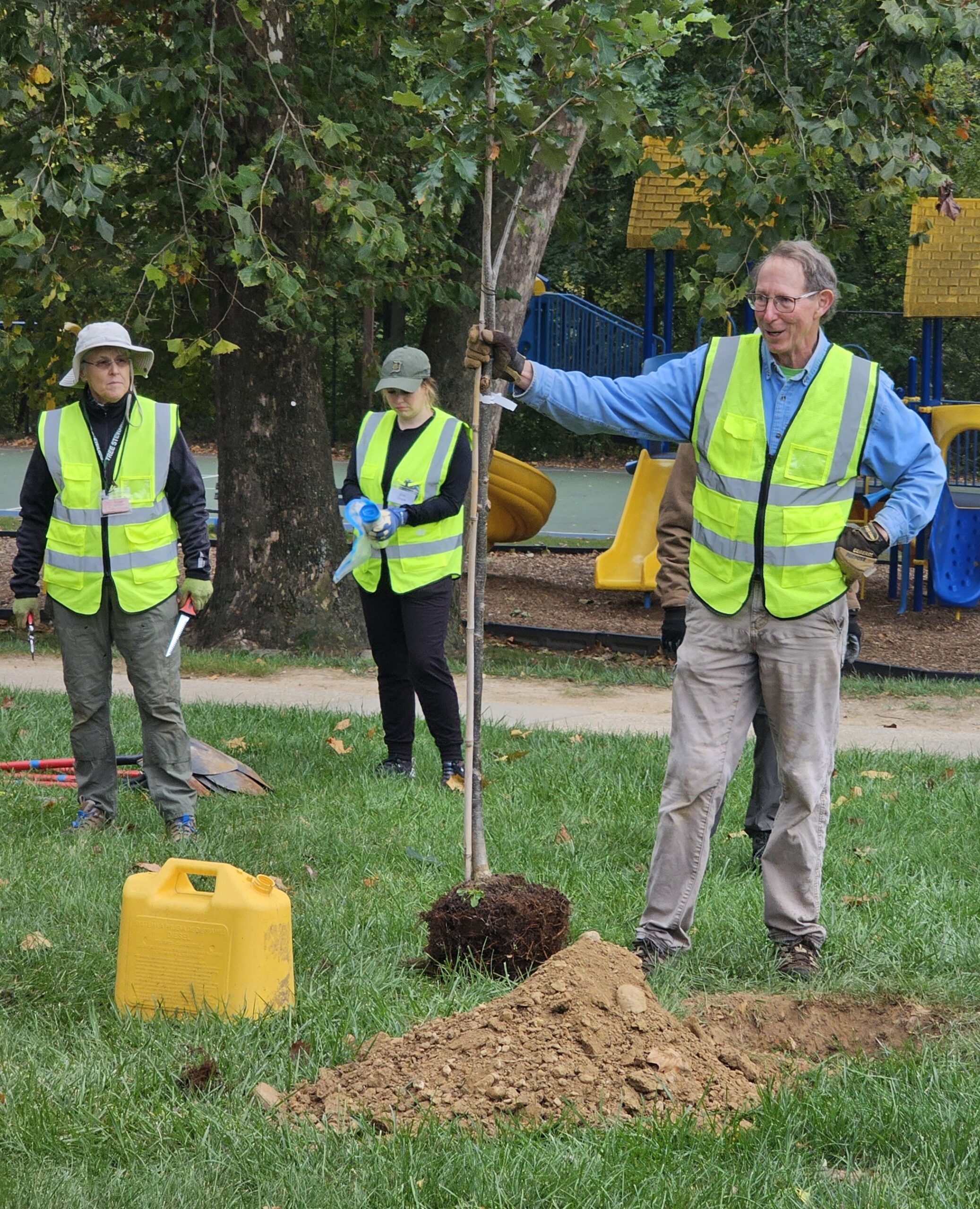 RusswithSeedling Russ Bailey shows proper tree planting technique. Photo by Mary Gillman