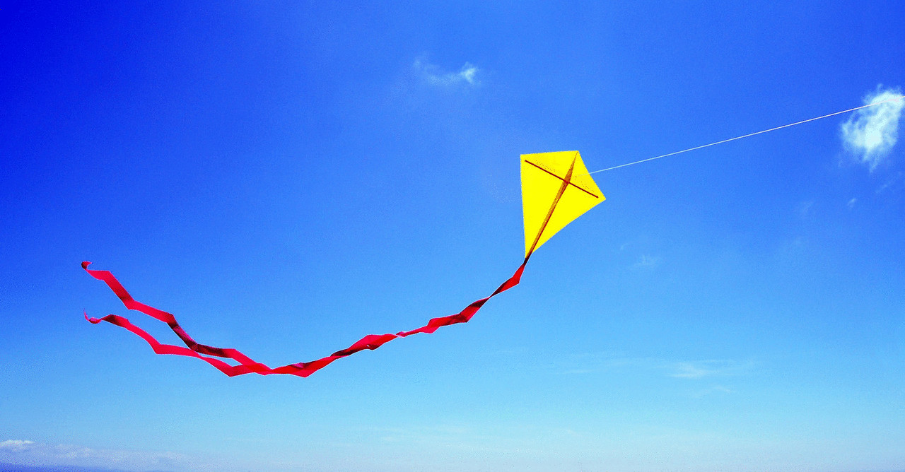 Kite on blue sky Hello kite flying in air.