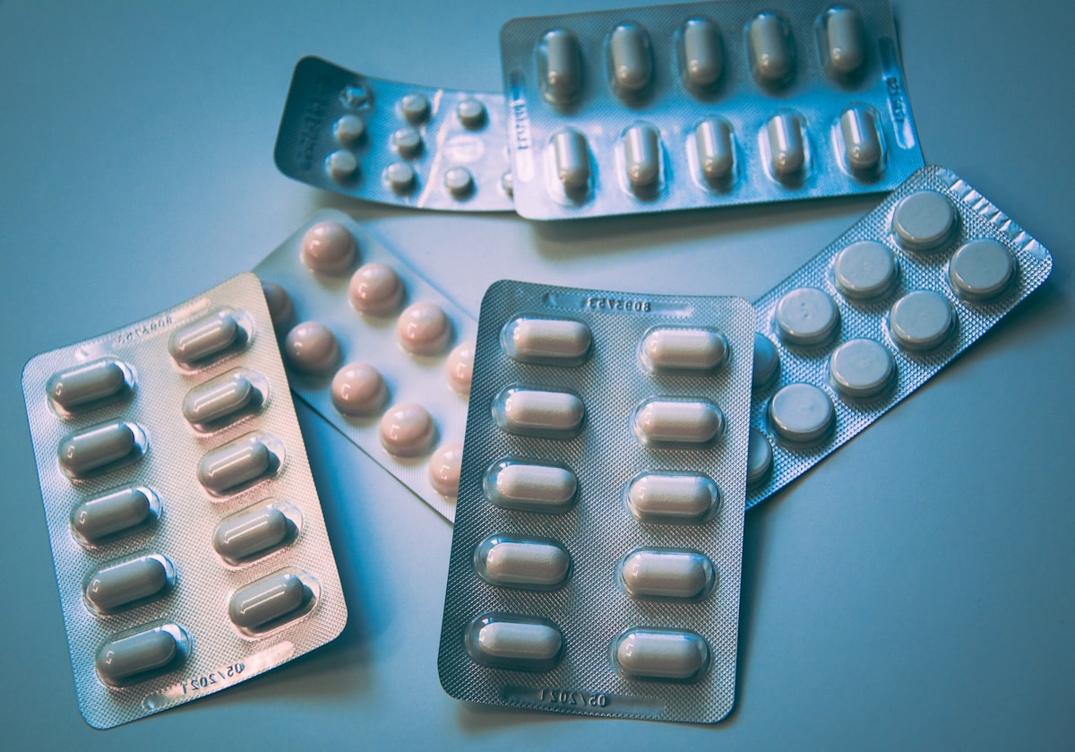 Pharmacist working with medication and prescription materials
