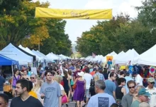 Crowds browse artist tents along Mount Vernon Avenue during Art on the Avenue in Del Ray, Alexandria.