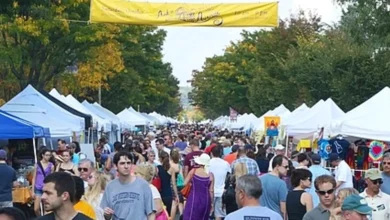 Crowds browse artist tents along Mount Vernon Avenue during Art on the Avenue in Del Ray, Alexandria.