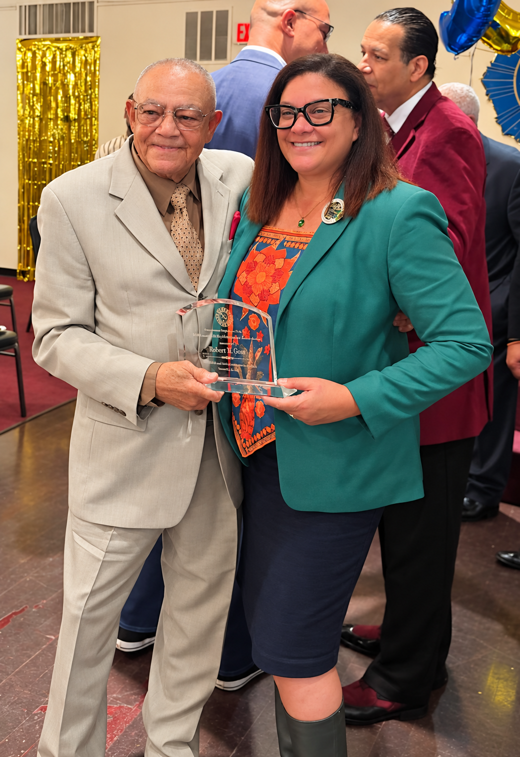 Robert Goss Receives DPC Member of the Year Award Robert Goss and City Councilmember Jacinta Greene hold his Departmental Progressive Club Member of the Year award at the club’s 99th anniversary celebration.