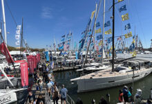 Crowds walk the floating docks among sailboats at the Annapolis Sailboat Show in Annapolis, Maryland