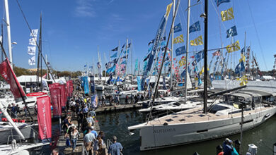 Crowds walk the floating docks among sailboats at the Annapolis Sailboat Show in Annapolis, Maryland