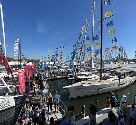 Crowds walk the floating docks among sailboats at the Annapolis Sailboat Show in Annapolis, Maryland