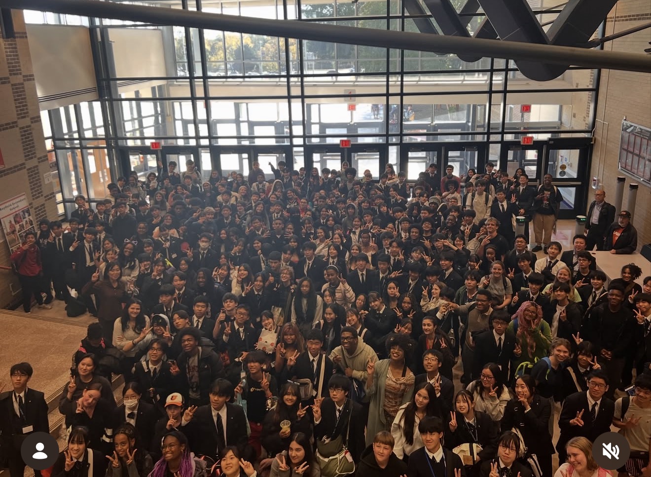 Students gather in Hayfield Secondary School’s lobby for a group photo taken from above during the Suma Gakuen exchange.