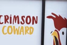 Crimson Coward name and rooster logo on the window of its upcoming Alexandria restaurant.