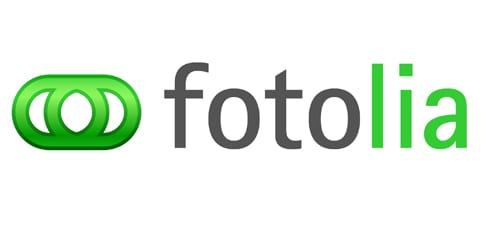 Logo displaying the text "fotolia" in lowercase letters, with "foto" in gray and "lia" in green, prefixed by a green icon resembling two interlocking rings.