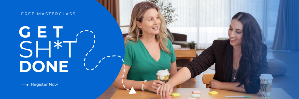 Two women sit at a table with coffee cups, working with sticky notes and pens. A text on the left side promotes a "Get Sh*t Done" masterclass, encouraging registration.