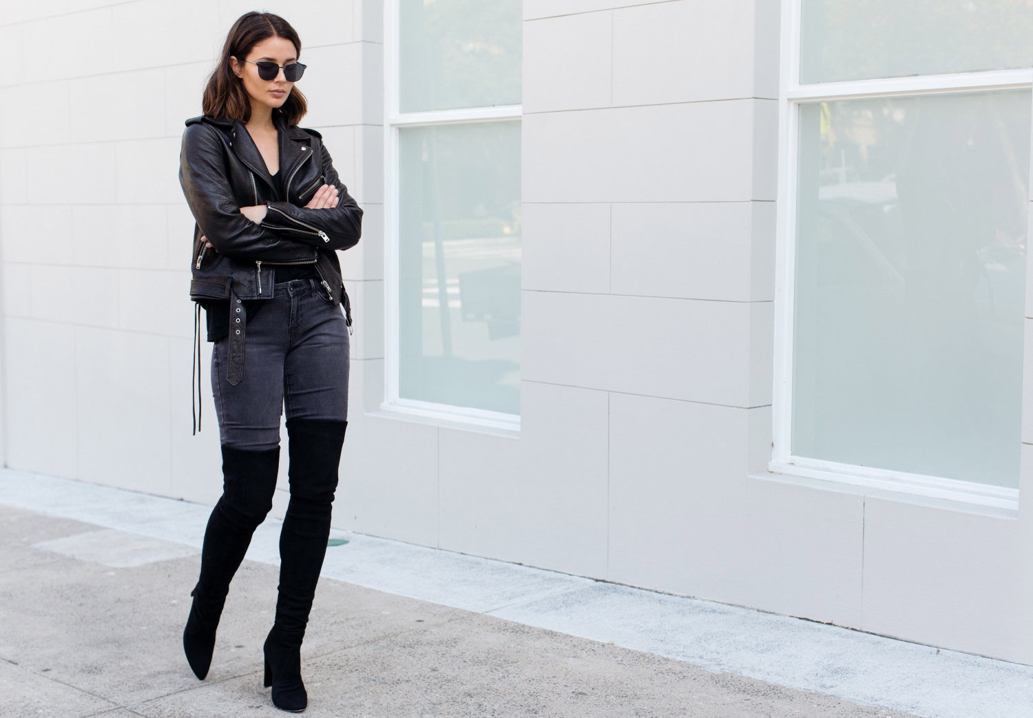 black over the knee boots with jeans