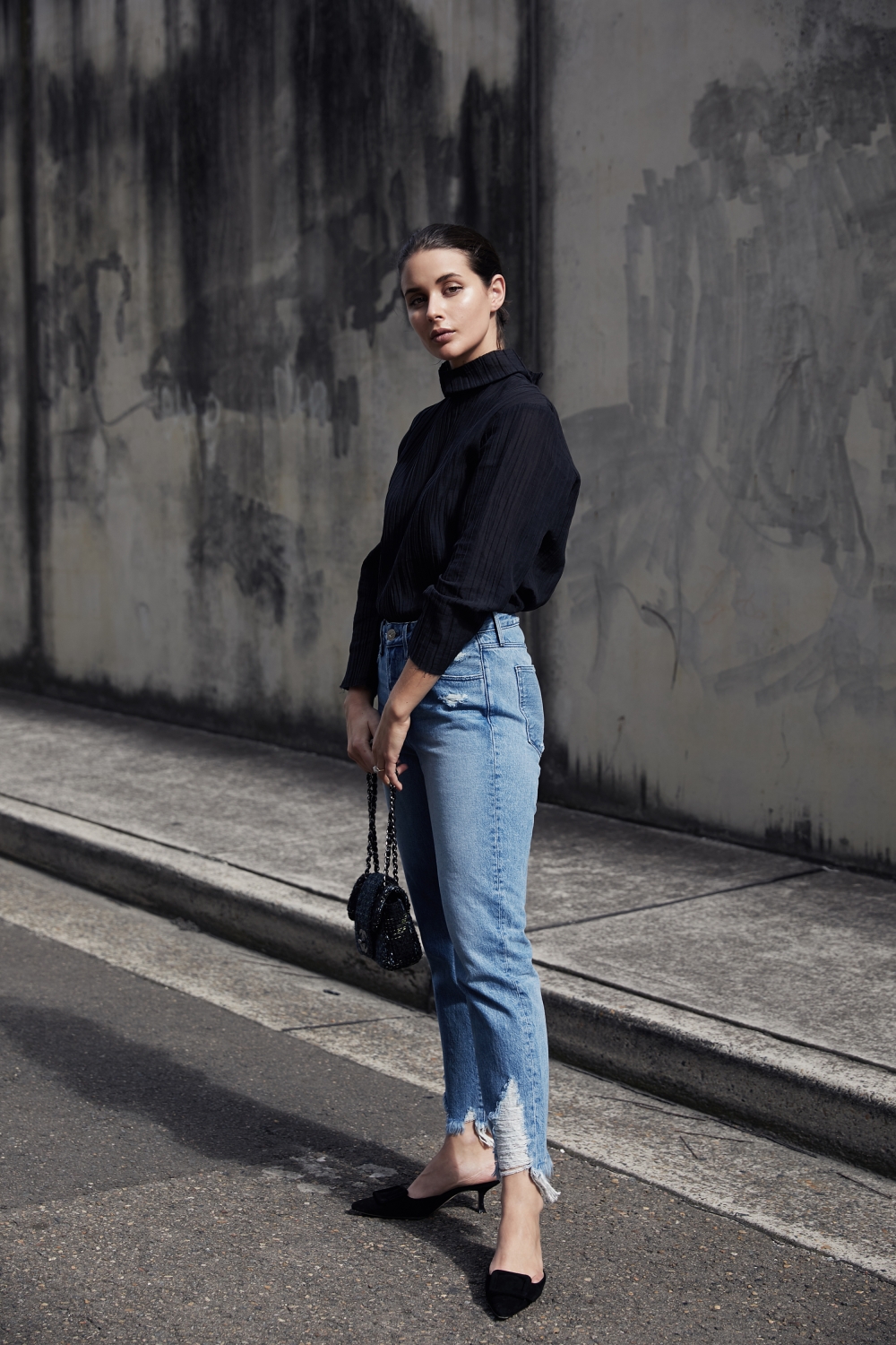 black top and blue jeans outfit