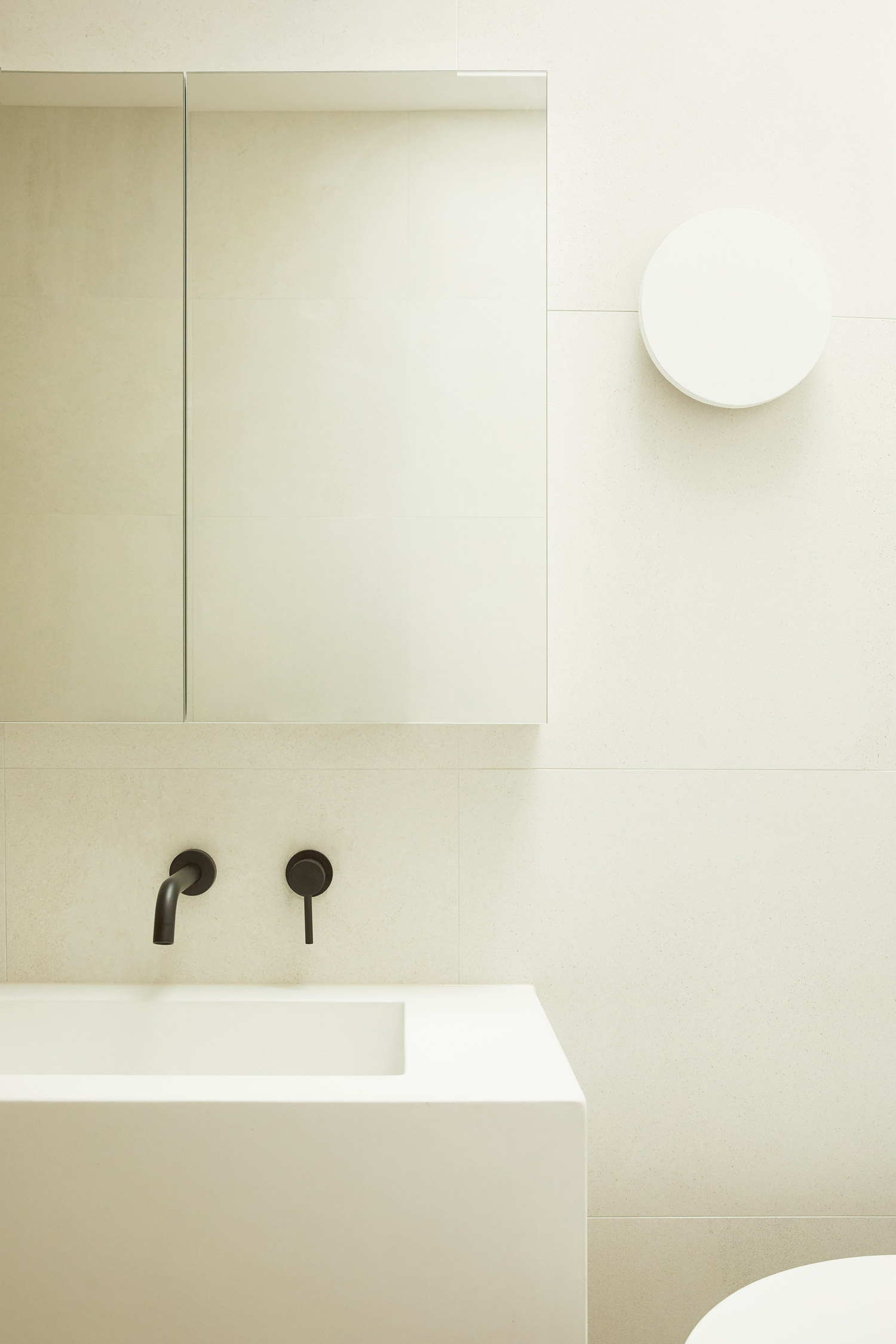 White Concrete sinks, black matte tapware, Warm minimalist bathroom in Sydney