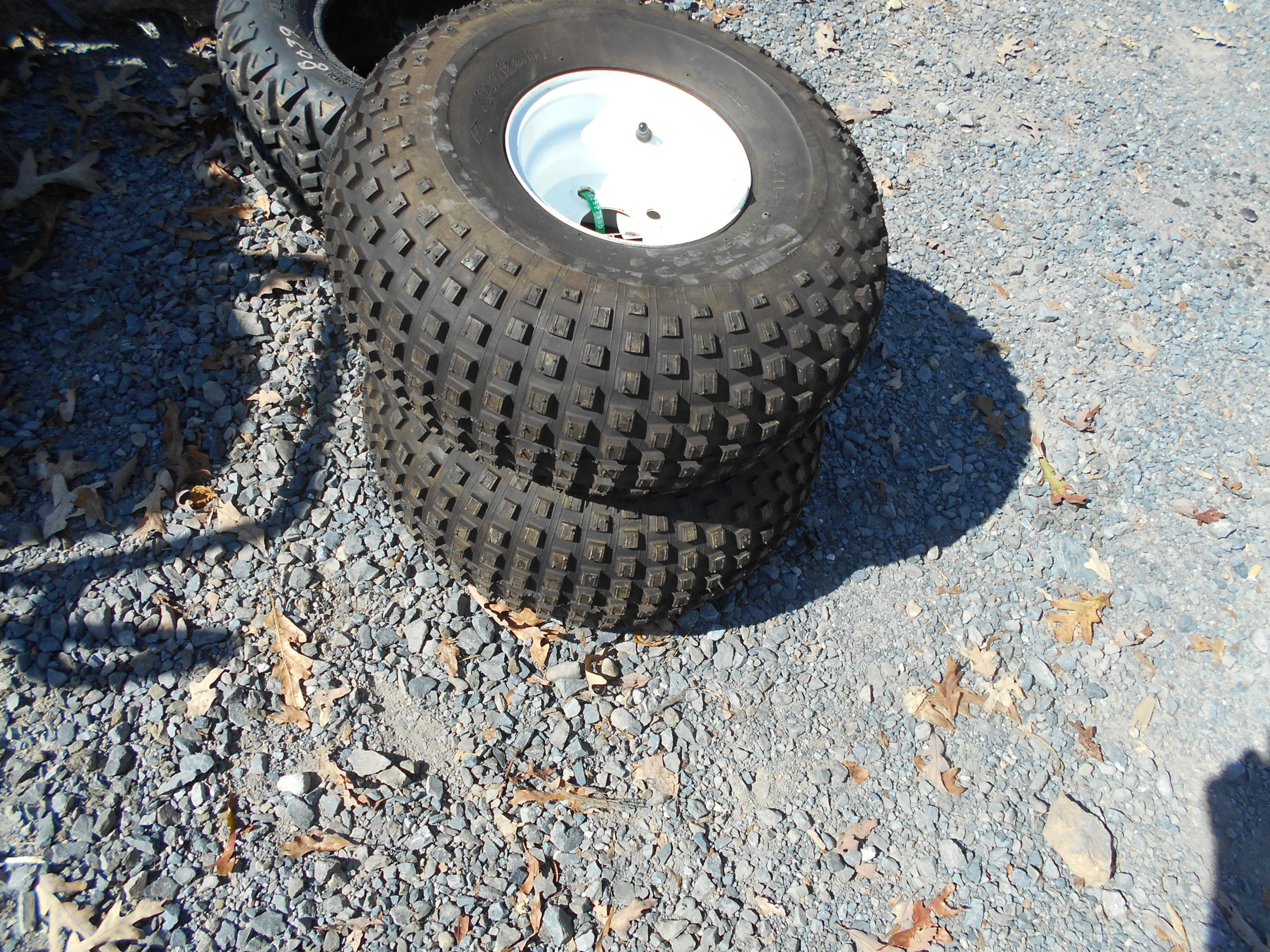 2527500 22 x 11 8 Tires on 4 lug Rims JM Equipment