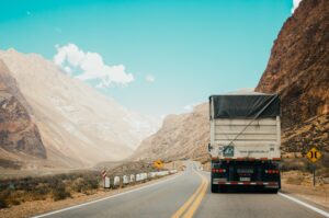 Truck driving along winding road