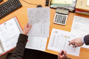two people processing paperwork to liquidate their business in Costa Rica
