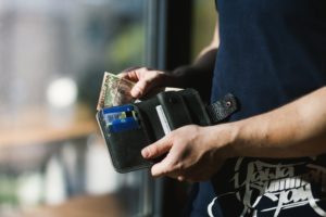 a wallet with money to pay for tax