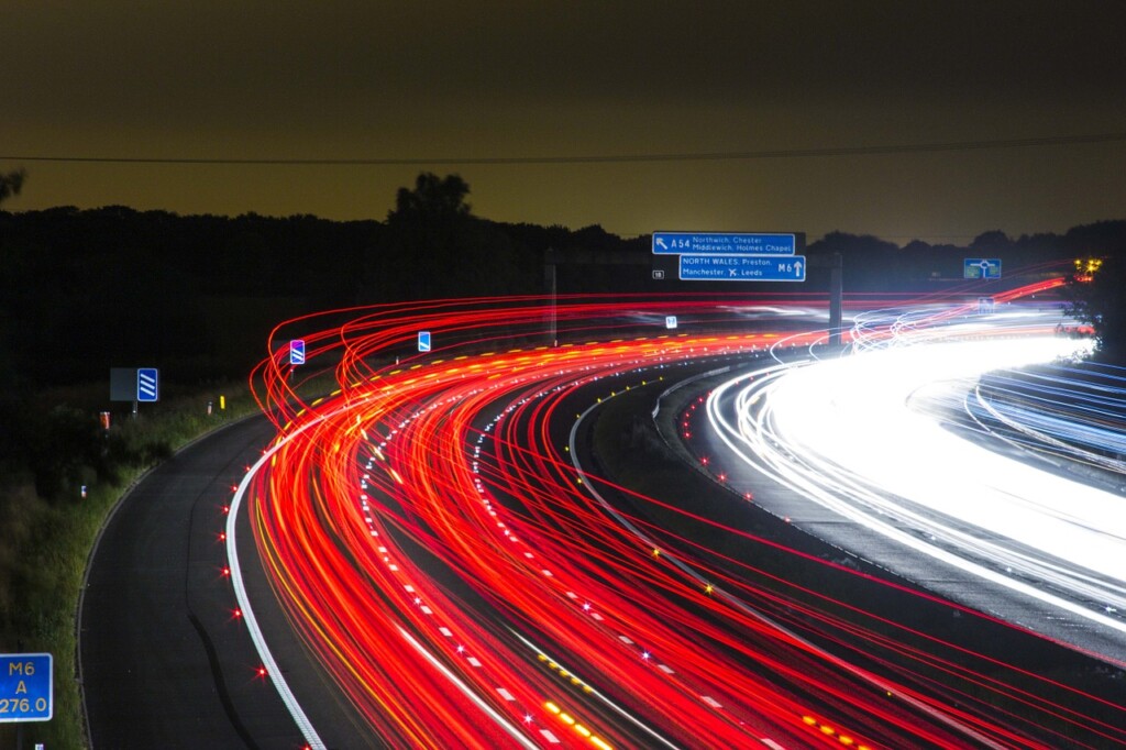Cars driving on the highway at night