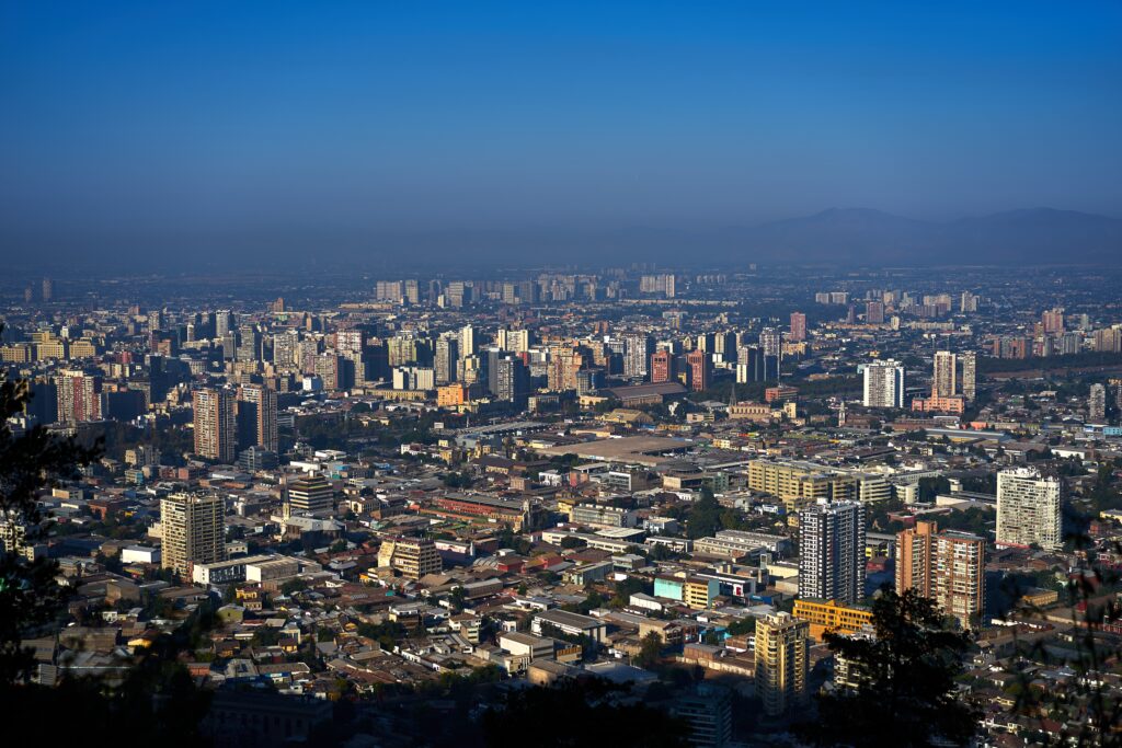 Aerial view of Santiago, Chile's capital, city where foreign investors can hire a legal advisor to comply with all invoicing requirements for a foreign company in Chile. 