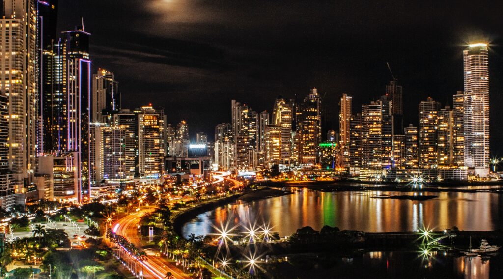 A stock image of Panama City at night, the capital city where many payroll outsourcing providers will be based.