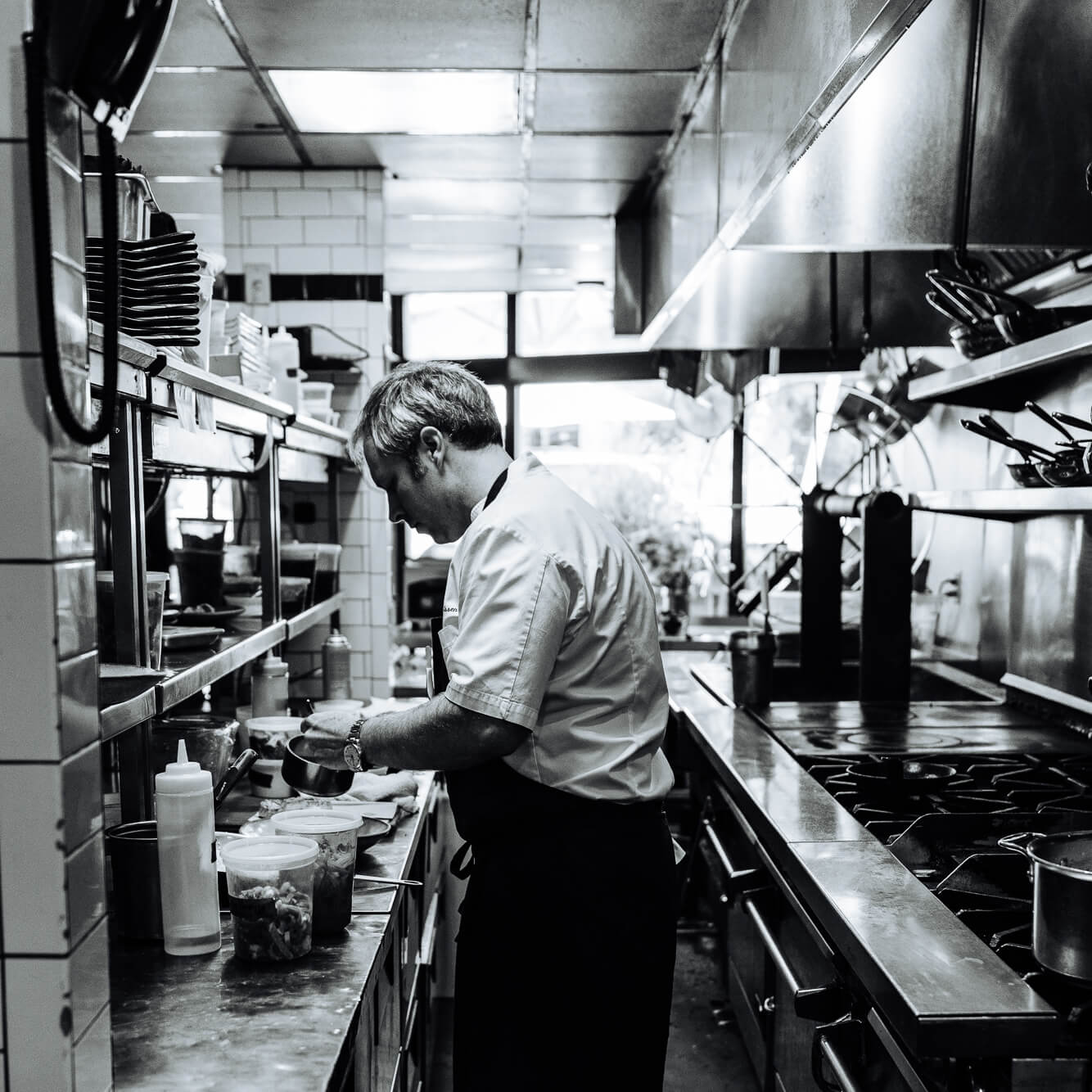 chef william dissen plating a farm to table dish