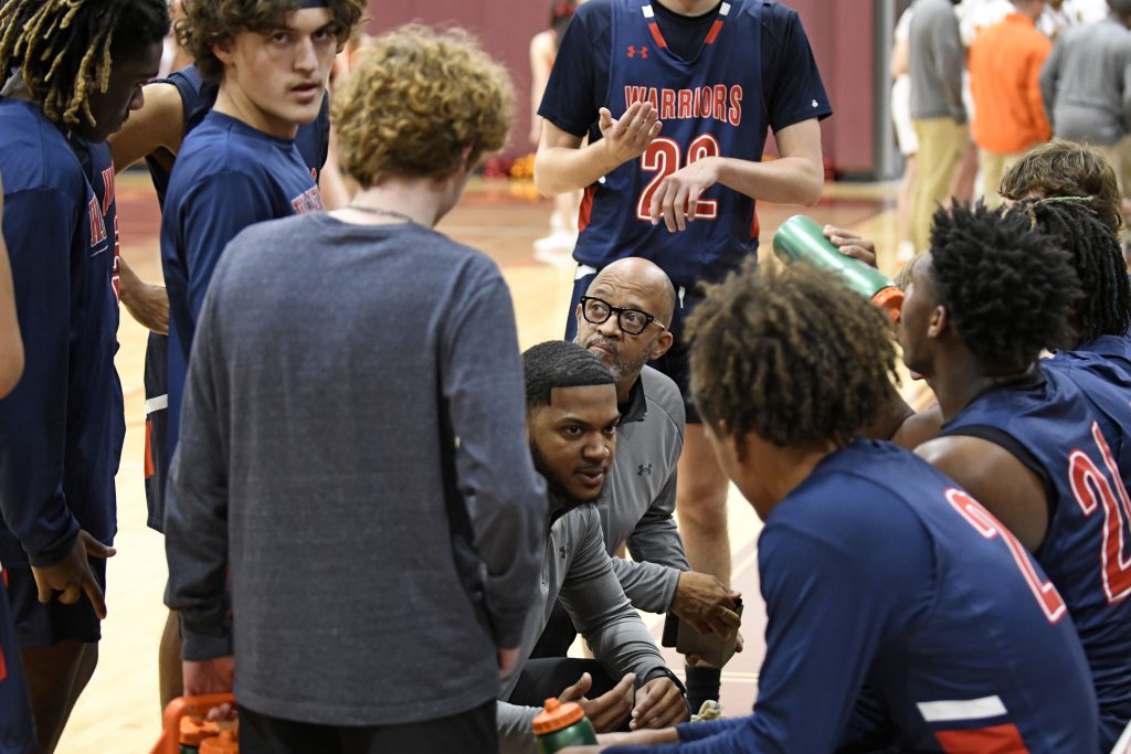 Magna Vista first -year coach Ty’Quan Graves talks with his players during a 30 second timeout Friday night in Vinton