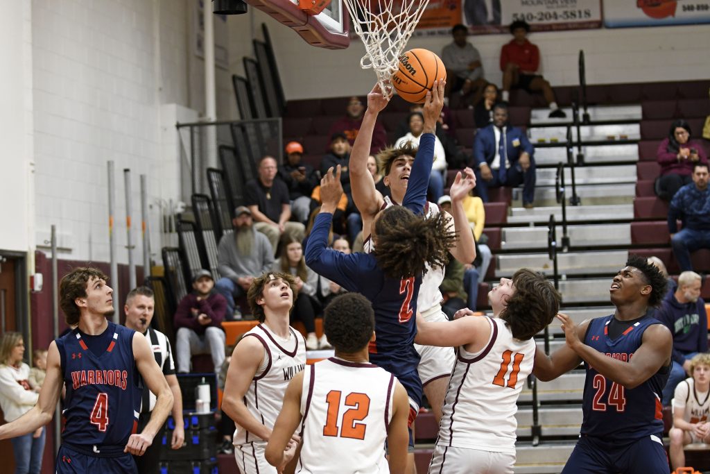 Magna Vista’s Torian Younger puts up a shot in heavy traffic Friday night against William Byrd in the first round of the Region 3D basketball tournament.