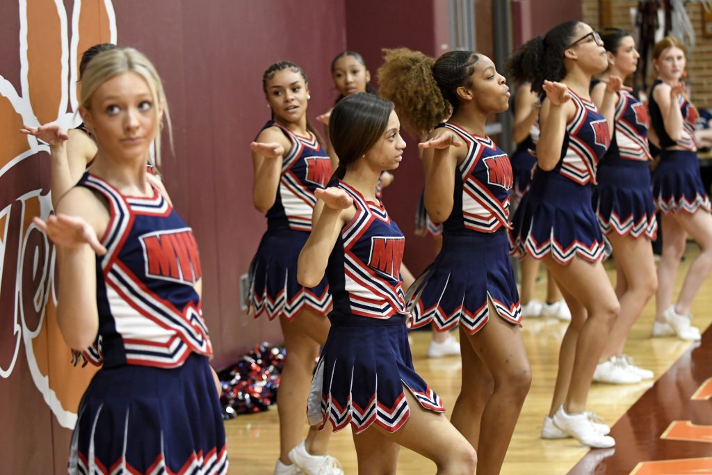 MV Varsity Cheer: The Magna Vista Varsity cheerleaders fire up the crowd Friday night in boys basketball action against William Byrd in Vinton.